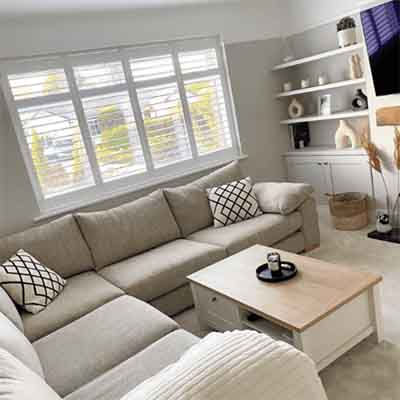 Window shutters installed in a living room window on the Wirral.